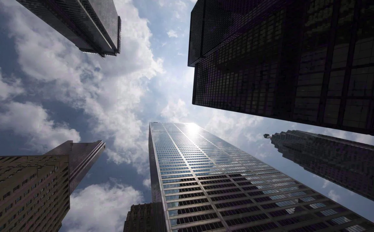 Bank towers on Bay Street in Toronto’s financial district, in a file photo. Governmental and financial systems’ vulnerability to cyberattacks has led to calls for coordinated international efforts to fortify cybersecurity defences. (The Canadian Press/Adrien Veczan)