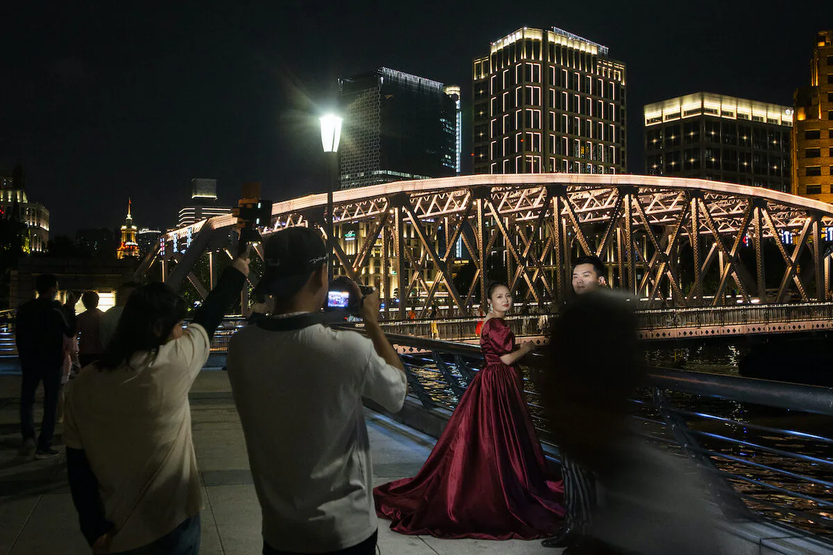 A couple have wedding photos taken on The Bund on September 10, 2021 in Shanghai, China. (Hu Chengwei/Getty Images)