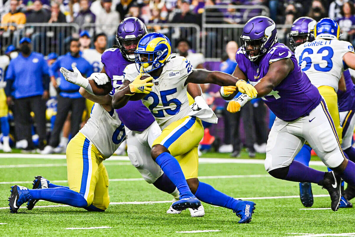 Sony Michel #25 of the Los Angeles Rams runs with the ball in the first quarter against the Minnesota Vikings during the first quarter at U.S. Bank Stadium, in Minneapolis, Minn., on Dec. 26, 2021. (Stephen Maturen/Getty Images)