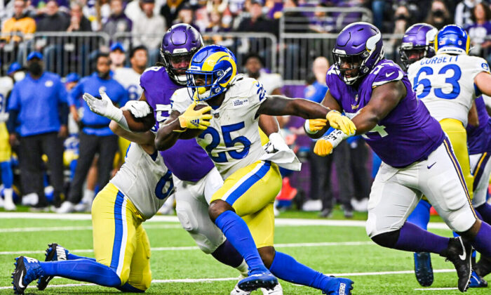 Sony Michel #25 of the Los Angeles Rams runs with the ball in the first quarter against the Minnesota Vikings during the first quarter at U.S. Bank Stadium, in Minneapolis, Minn., on Dec. 26, 2021. (Stephen Maturen/Getty Images)