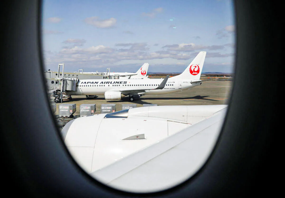 Japan Airlines (JAL) planes sit on the tarmac at New Chitose Airport, in Sapporo, Hokkaido, Japan, on May 4, 2021. (Issei Kato/Reuters)