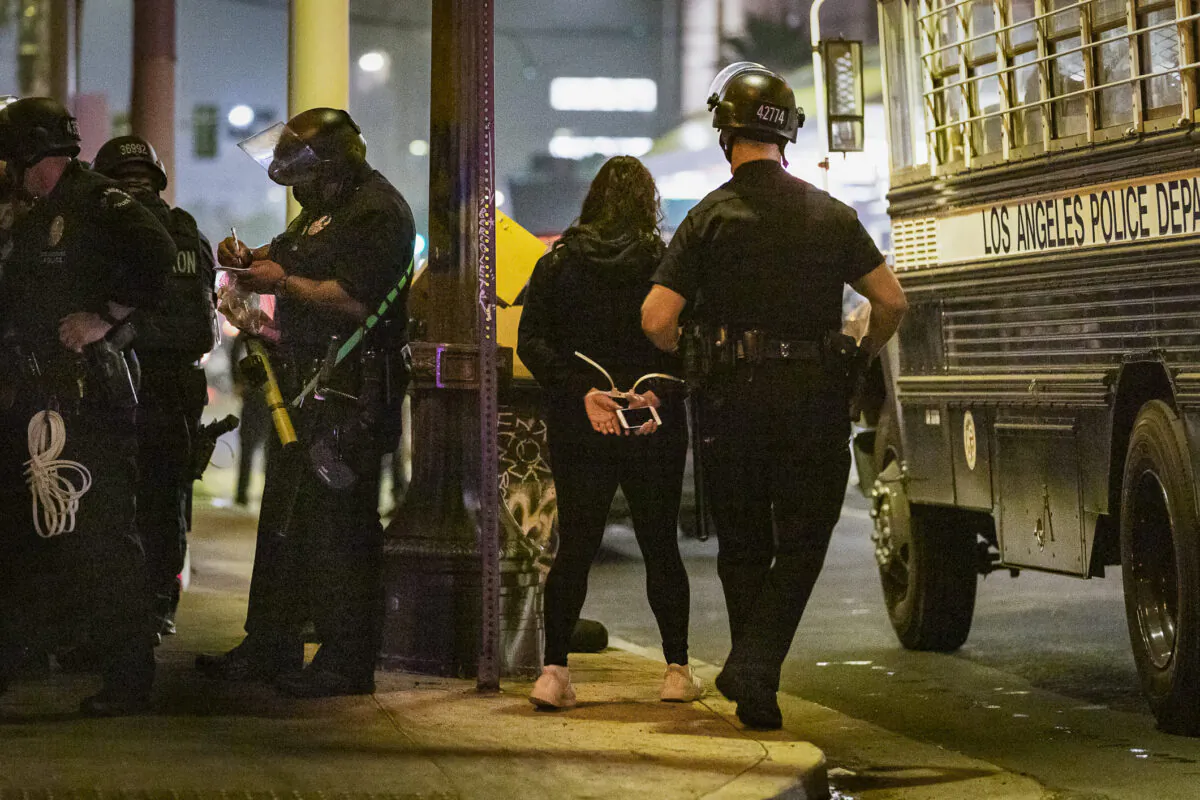Los Angeles Police Department officers respond to unlawful assemby in downtown Los Angeles on Nov. 3, 2020. (John Fredricks/The Epoch Times)