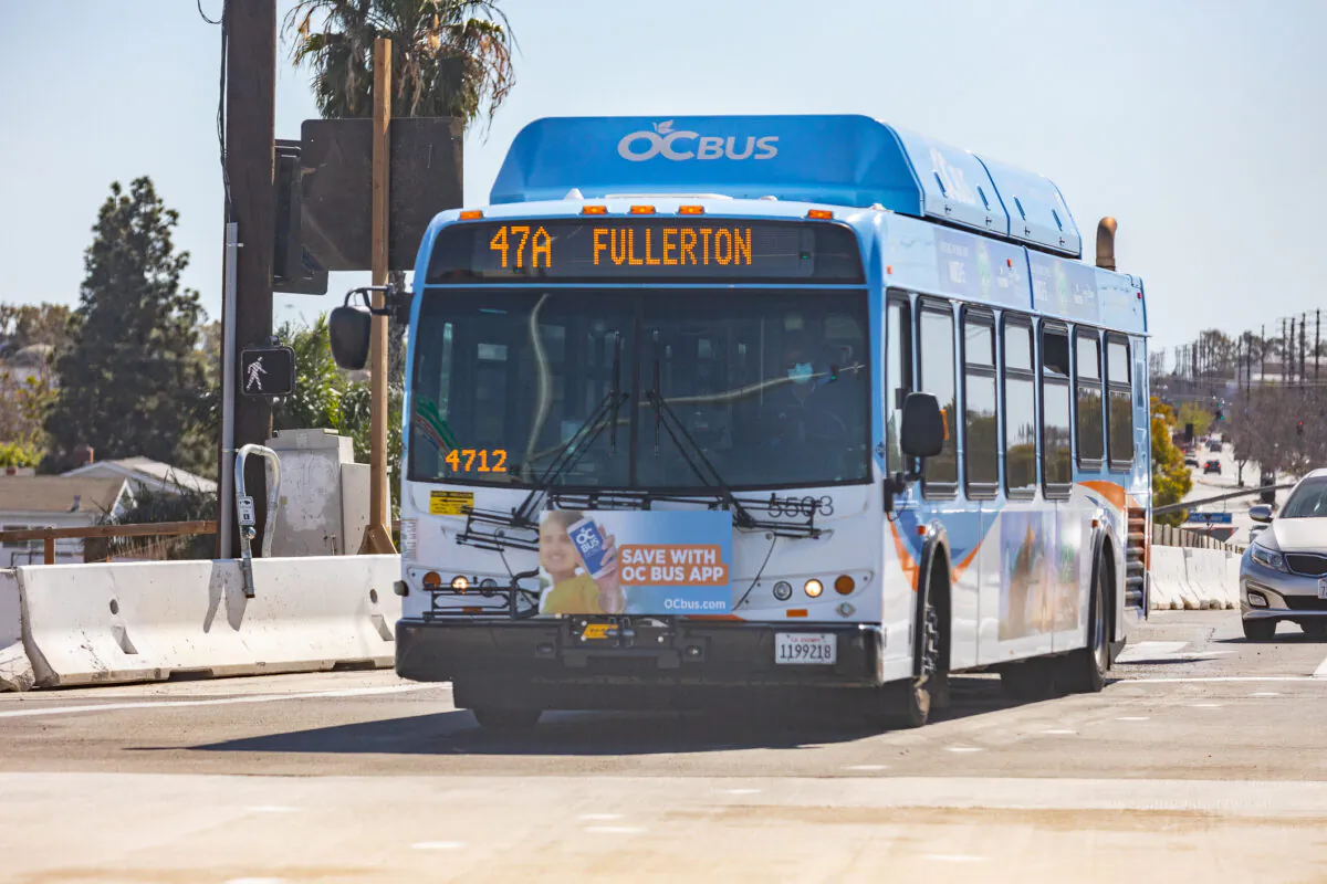 An Orange County Transportation Authority bus transports passengers to Fullerton, Calif., on March 1, 2021. (John Fredricks/The Epoch Times)