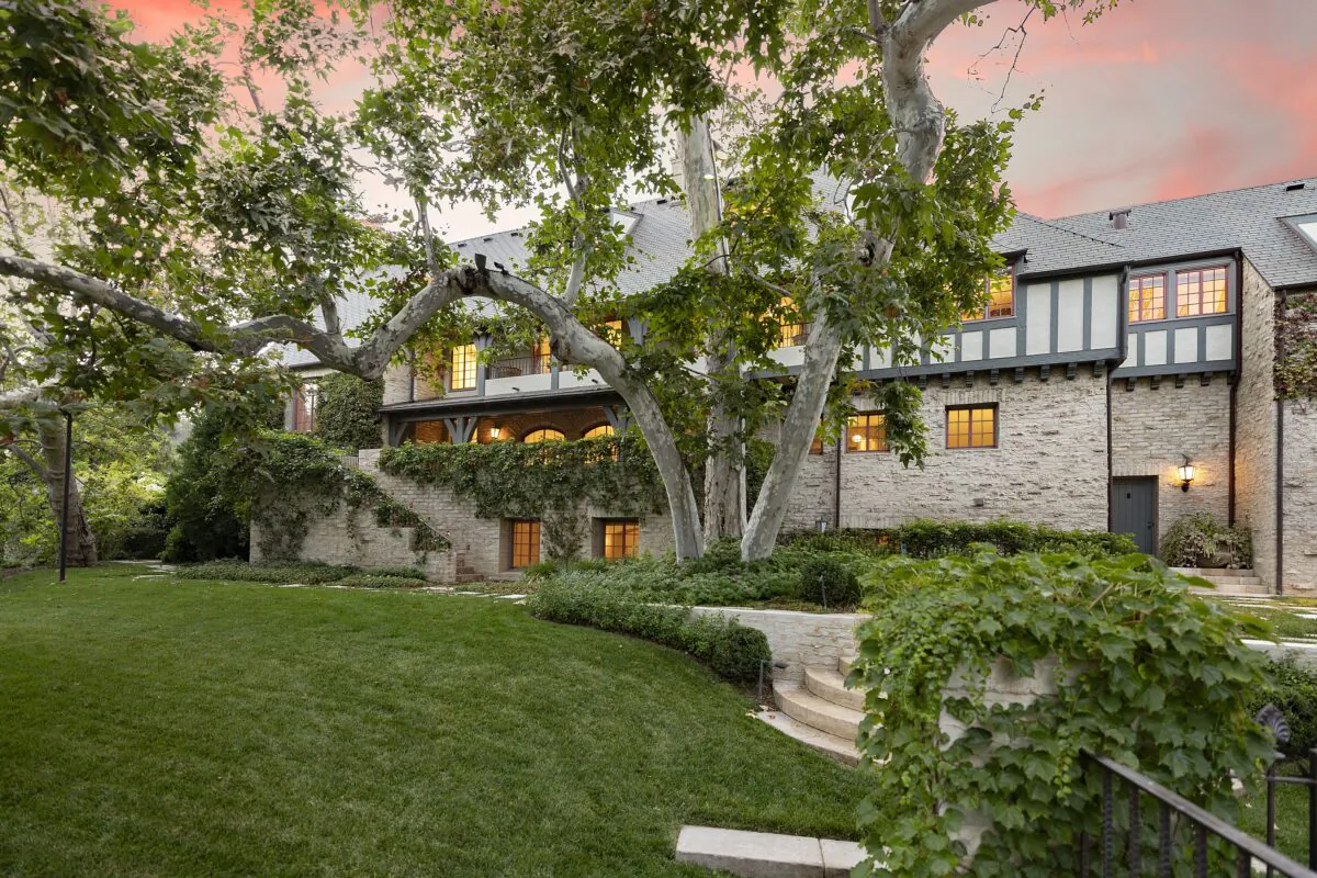 The mansion's Tudor design seems to blend into the lush garden paradise created around it. (Courtesy of Jim Bartsch/Jade Mills)