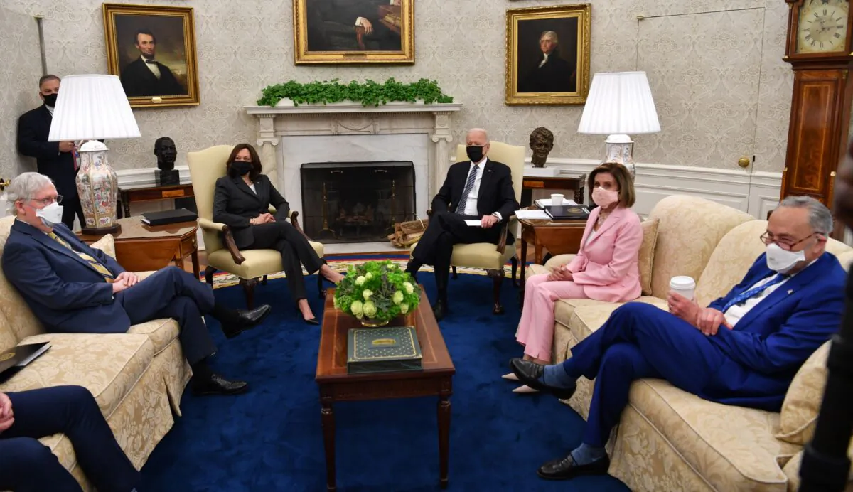 U.S. President Joe Biden (3rd R) and US Vice President Kamala Harris (L) meet with members of Congressional Leadership, including Senate Majority Leader Chuck Schumer (R), Speaker of the House Nancy Pelosi (2nd R) and Senate Minority Leader Mitch McConnell, to discuss policy areas of mutual agreement, in the Oval Office of the White House in Wash., on May 12, 2021. (Nicholas Kamm/AFP via Getty Images)