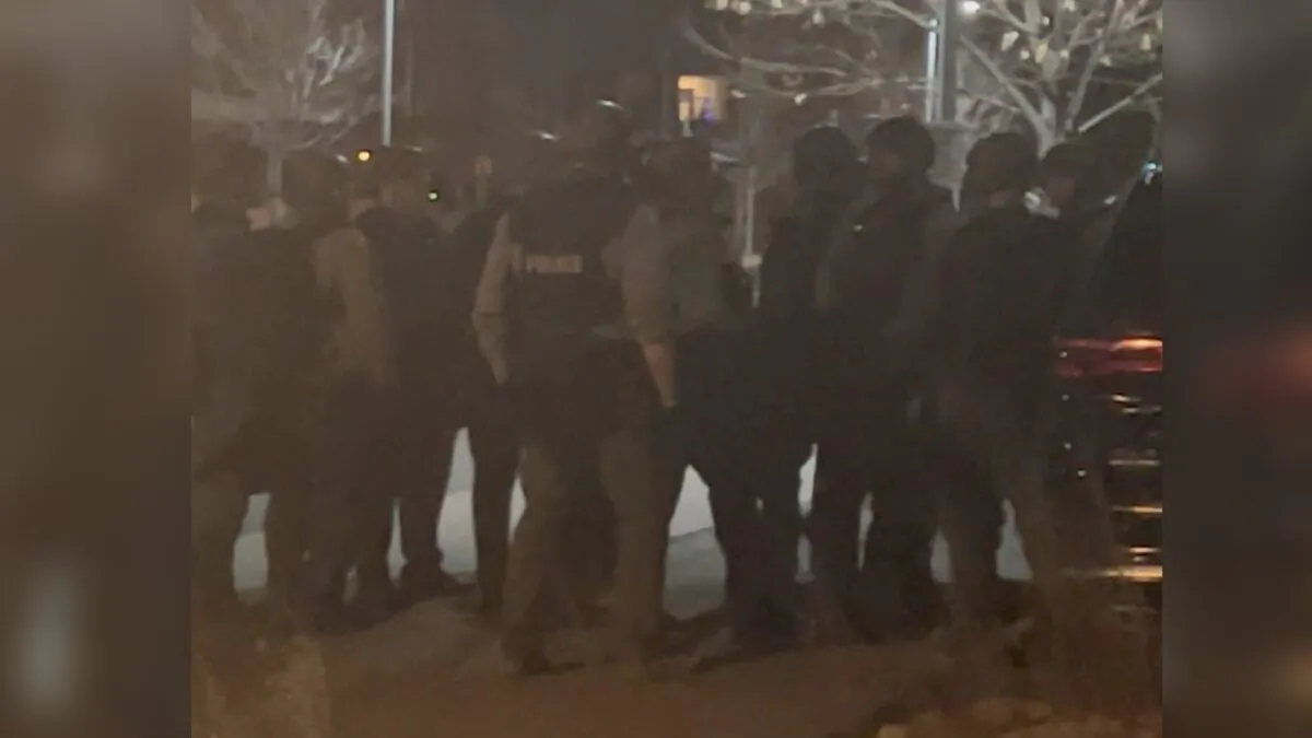 Officers gather in the street in Lakewood, Colo., on Dec. 27, 2021, in this still image taken from a social media video. (Hawk Hawkins/via Reuters)