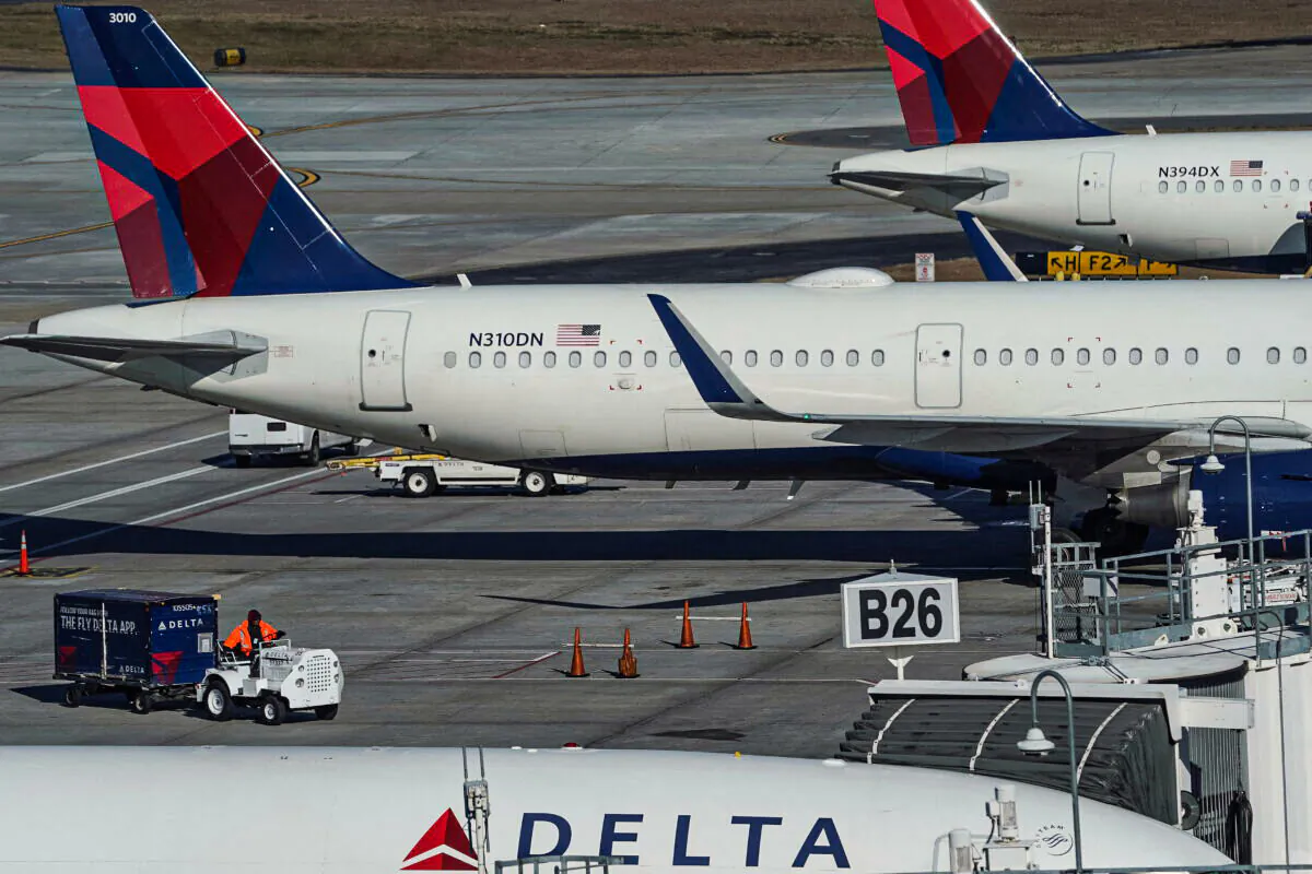 Delta Air Lines jets are seen at gates at Hartsfield-Jackson Atlanta International Airport in Atlanta, on Dec. 22, 2021. (Elijah Nouvelage/Reuters)