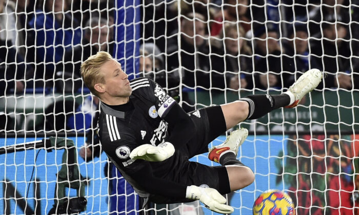 Leicester's goalkeeper Kasper Schmeichel makes a save penalty in front of Liverpool's Mohamed Salah during the English Premier League soccer match between Leicester City and Liverpool at the King Power Stadium in Leicester, England, on Dec. 28, 2021. (Rui Vieira/AP Photo)