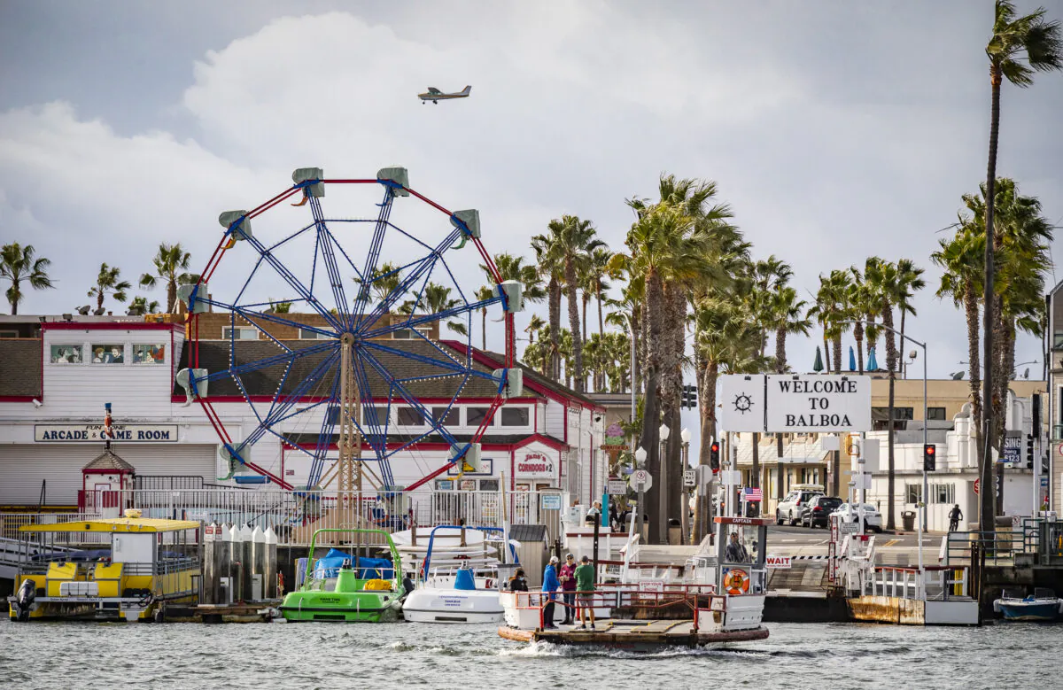 People enjoy riding the Balboa Island Ferry boats across the harbor in Newport Beach, Calif., on Dec. 29, 2021. (John Fredricks/The Epoch Times)