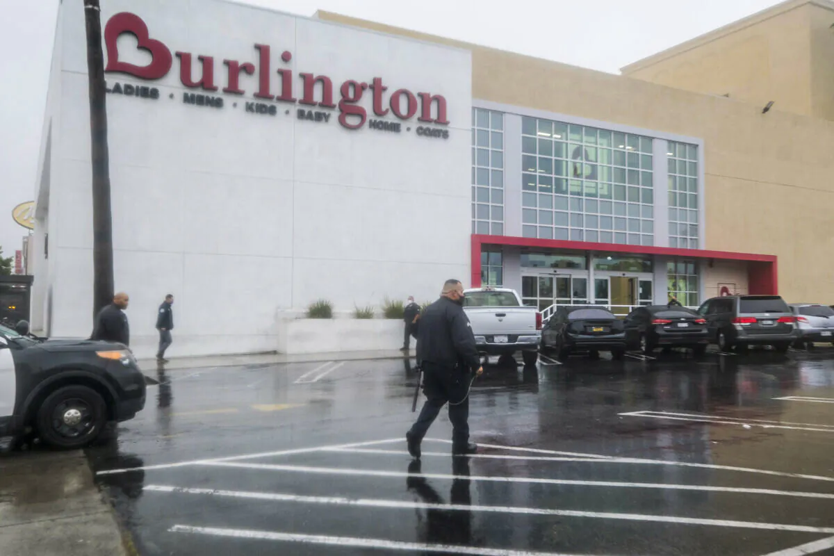 Police officers work at the scene where two people were struck by gunfire in a shooting at a Burlington store, in North Hollywood, Calif., on Dec. 23, 2021. (Ringo H.W. Chiu/AP Photo)