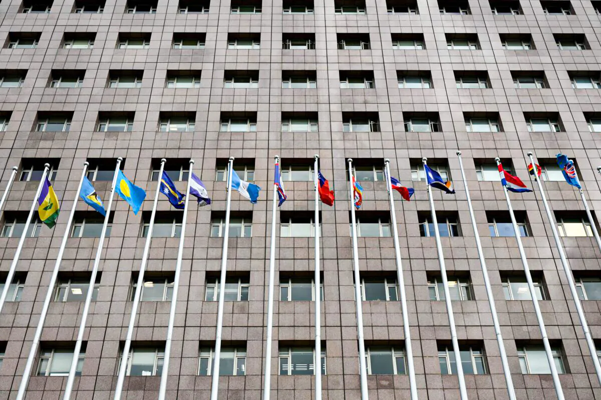 Flags fly outside the Diplomatic Quarter, a building in Taipei which houses most of nations which still retain diplomatic ties with Taiwan, on Dec. 10, 2021, after Nicaragua inked a deal switching diplomatic allegiance from Taiwan to China. (Sam Yeh/AFP via Getty Images)