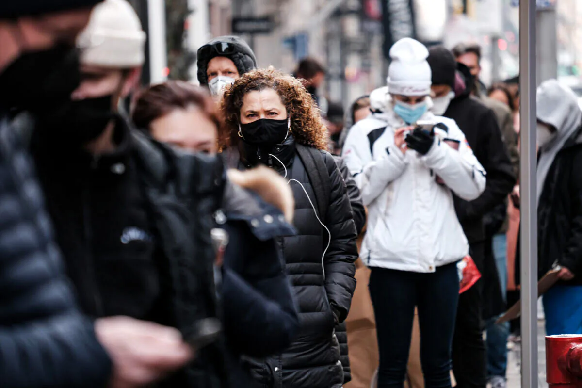 People wait in long lines in Manhattan to get tested for COVID-19 in New York City on Dec. 22, 2021. (Spencer Platt/Getty Images)