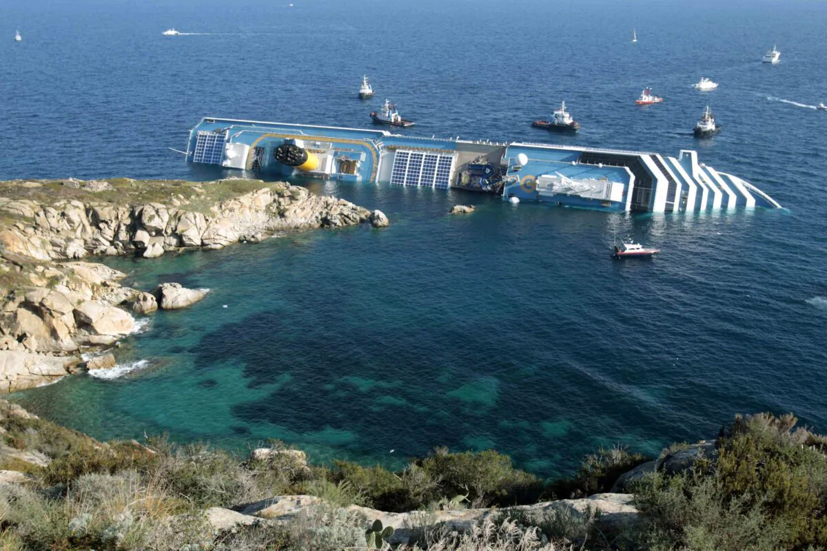 The luxury cruise ship Costa Concordia leans on its side after running aground in the tiny Tuscan island of Giglio, Italy, on Jan. 14, 2012. (Gregorio Borgia/AP Photo)