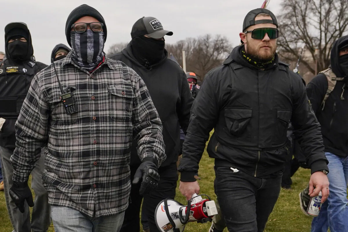 Proud Boys members Joseph Biggs (L) and Ethan Nordean (R) with megaphone, walk toward the U.S. Capitol, on Jan. 6, 2021. (Carolyn Kaster/AP Photo)