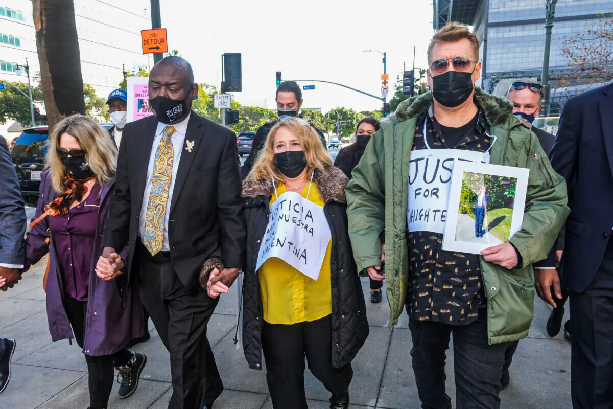 Juan Pablo Orellana Larenas (R), Soledad Peralta (2nd R), the parents of Valentina Orellana-Peralta, and attorney Ben Crump (2nd L), arrive for a news conference outside the Los Angeles Police Department headquarters in Los Angeles, on Dec. 28, 2021. (Ringo H.W. Chiu/AP Photo)