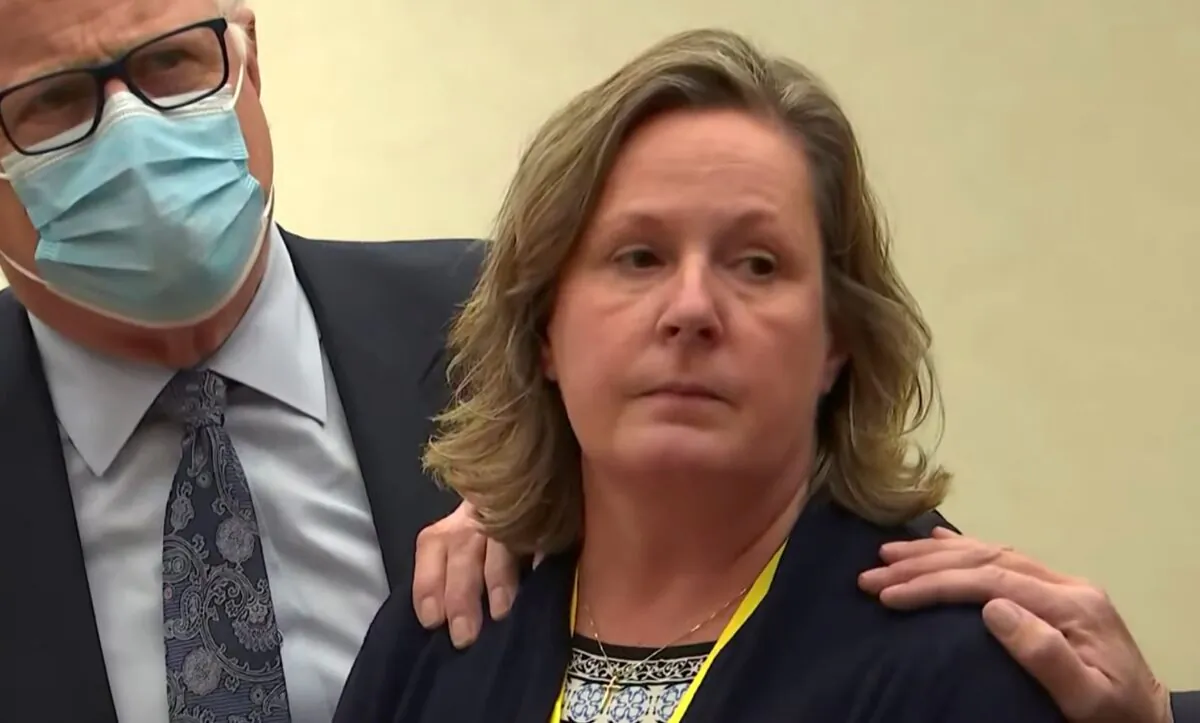 Former Brooklyn Center Police Officer Kim Potter stands with defense attorney Earl Gray, as the verdict is read at the Hennepin County Courthouse in Minneapolis, on Dec. 23, 2021, in a still from a video. (Court TV via AP, Pool)