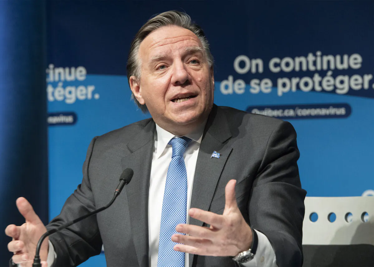 Quebec Premier Francois Legault speaks during a news conference in Montreal on Dec. 30, 2021. (Graham Hughes/The Canadian Press)