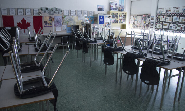 An empty classroom is pictured at Eric Hamber Secondary school in Vancouver, B.C., on March 23, 2020. (Jonathan Hayward/The Canadian Press)
