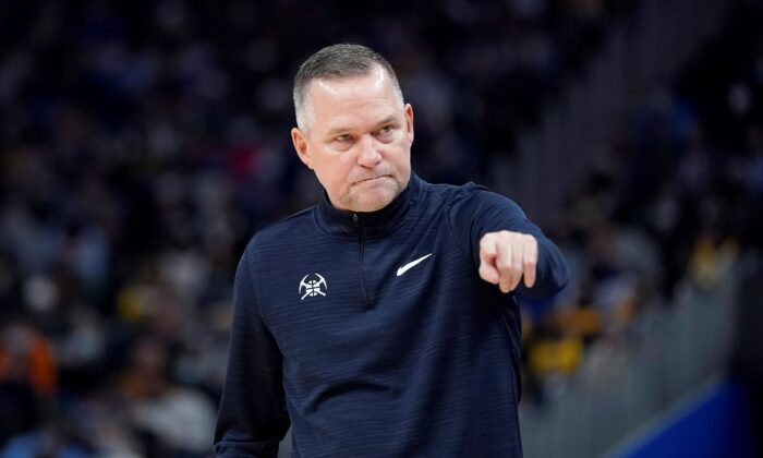 Denver Nuggets head coach Michael Malone gestures toward players during the first half of the team's NBA basketball game against the Golden State Warriors in San Francisco on Dec. 28, 2021. (Jeff Chiu/AP Photo)