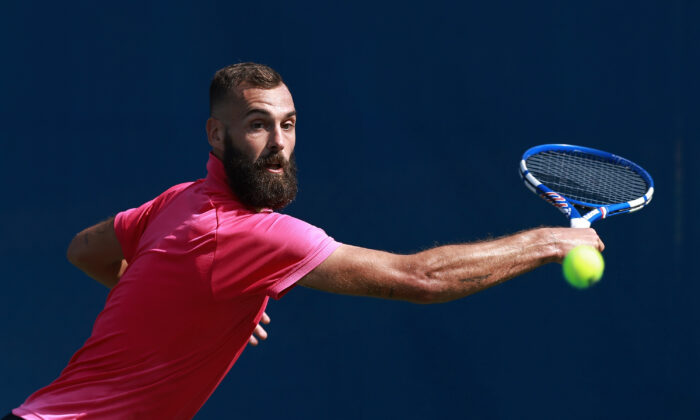 Benoit Paire of France returns a shot to Emil Ruusuvuori of Finland on Day 5 of the Winston-Salem Open at Wake Forest Tennis Complex in Winston Salem, North Carolina.  on Aug. 25, 2021. (Grant Halverson/Getty Images)