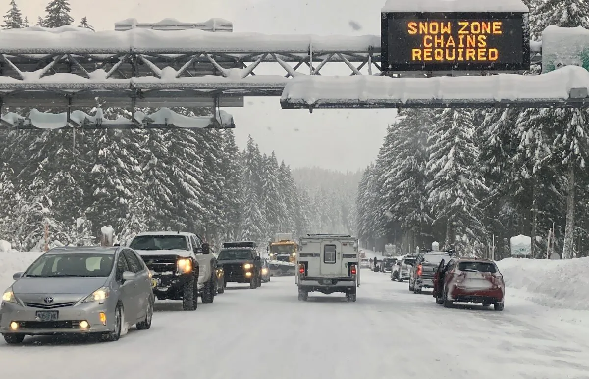 Heavy traffic is seen at the base of a snowy Santiam Pass in Detroit, Ore., on Dec. 26, 2021.(Andrew Selsky/AP Photo)