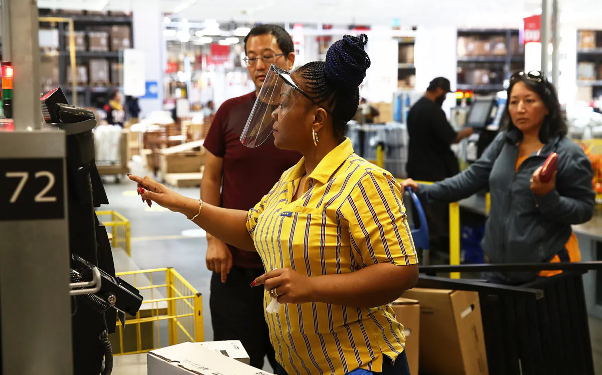 Staff at the checkout are seen in Ikea on June 01, 2020 in London, England. (Julian Finney/Getty Images)