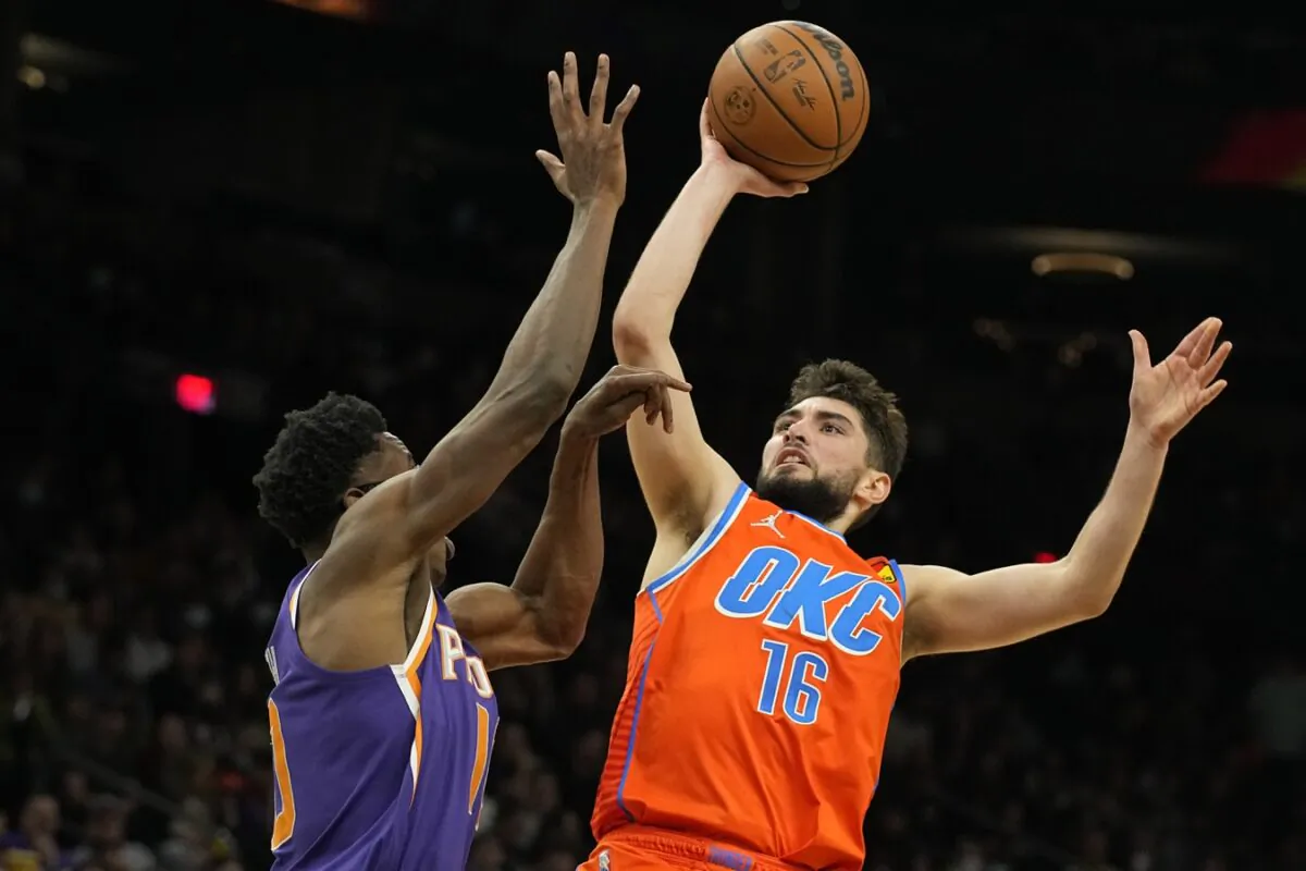 Oklahoma City Thunder guard Ty Jerome (16) shoots over Phoenix Suns forward Jalen Smith (10) in the second half at Footprint Center in Phoenix, Ariz., on Dec. 29, 2021. (Rick Scuteri-USA TODAY Sports via Field Level Media)