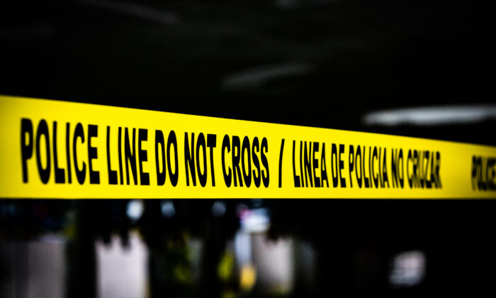 Crime scene tape in Santa Ana, Calif., on March 11, 2021. (John Fredricks/The Epoch Times)