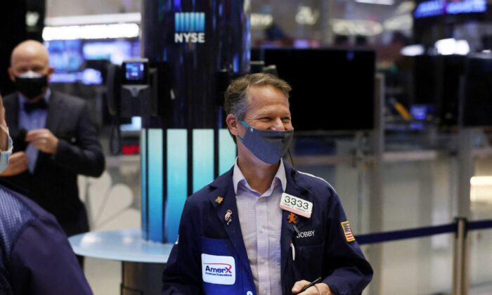 A trader works on the trading floor at the New York Stock Exchange (NYSE) in Manhattan, New York City, on Dec. 28, 2021. (Andrew Kelly/Reuters)