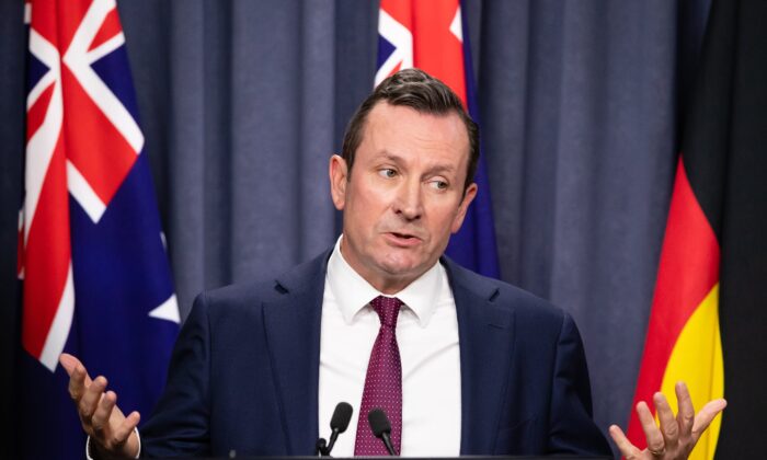 WA Premier Mark McGowan speaks during an announcement in Perth, Australia, on Dec. 13, 2021. West Australians will be reconnected to the rest of the country on Feb. 5 after almost two years of border closures. (Richard Wainwright/AAP Image)