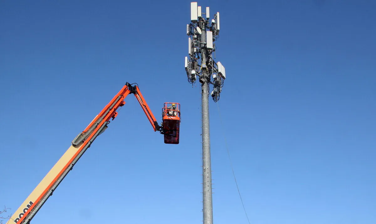 A contract crew from Verizon installs 5G telecommunications equipment on a tower in Orem, Utah, on Dec. 3, 2019. (George Frey/Reuters)