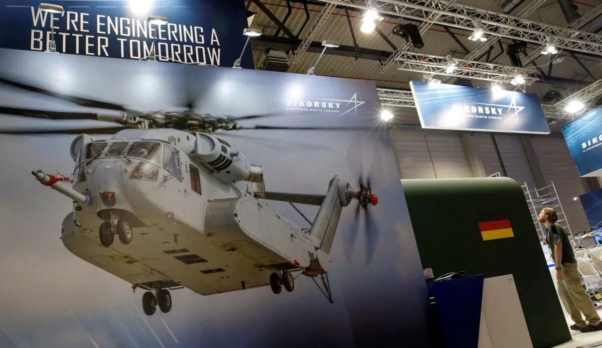 A photograph of a CH-53 helicopter is pictured at the booth of Sikorsky-Lockheed Martin company during preparation for the ILA Berlin Air Show in Schoenefeld, south of Berlin, Germany, on May 31, 2016. (Fabrizio Bensch/Reuters)