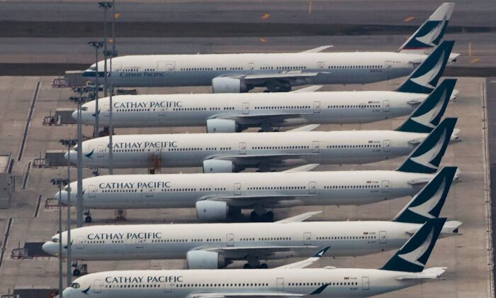 Cathay Pacific Airways aircrafts line up on the tarmac at the Hong Kong International Airport, in Hong Kong, China, on March 6, 2020. (Kin Cheung/AP Photo)