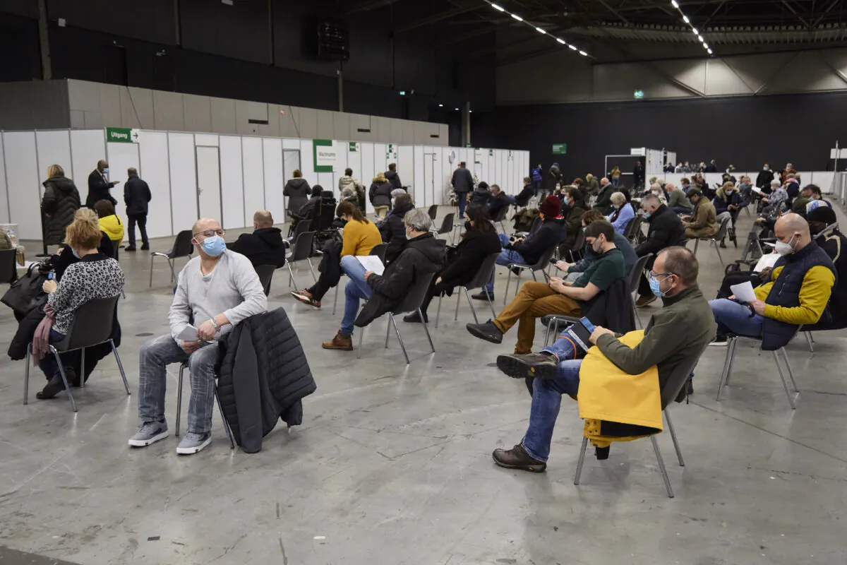 People are waiting 15 minutes in a waiting room after a booster vaccination in a vaccination center located in concert hall Ahoy in Rotterdam, Netherlands, on Dec. 29, 2021. (Pierre Crom/Getty Images)