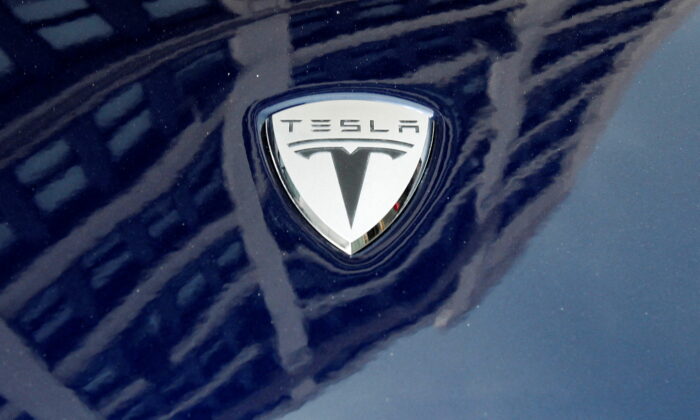A logo of Tesla Motors on an electric car model is seen outside a showroom in N.Y., on June 28, 2010. (Shannon Stapleton/Reuters)