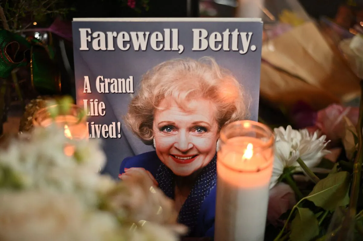 Flowers, candles and mementos cover the star of late actress Betty White on the Hollywood Walk of Fame, in Hollywood, Calif., on Dec. 31, 2021. (Robyn Beck/AFP via Getty Images)