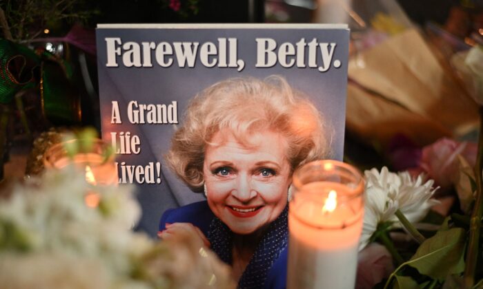 Flowers, candles and mementos cover the star of late actress Betty White on the Hollywood Walk of Fame, in Hollywood, Calif., on Dec. 31, 2021. (Robyn Beck/AFP via Getty Images)