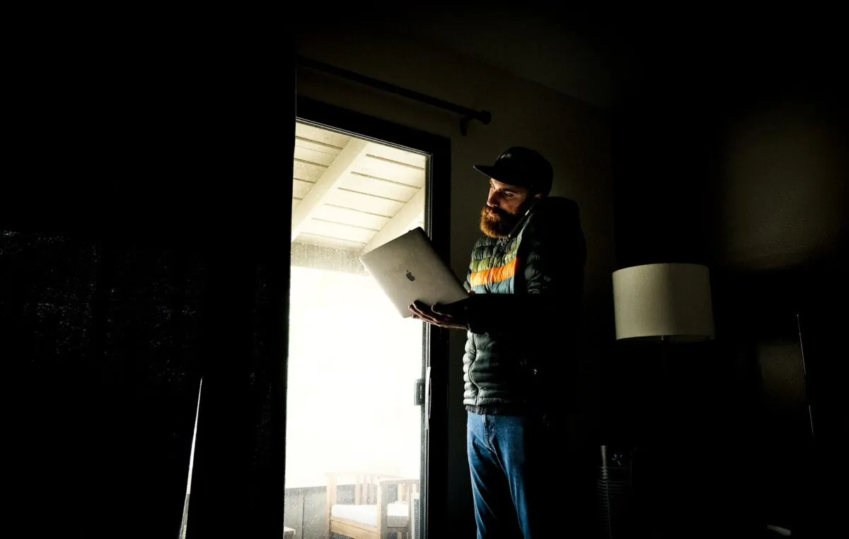 Tanner Grimshaw looks over his identity theft case in Irvine, Calif., on Jan. 31, 2022. (John Fredricks/The Epoch Times)