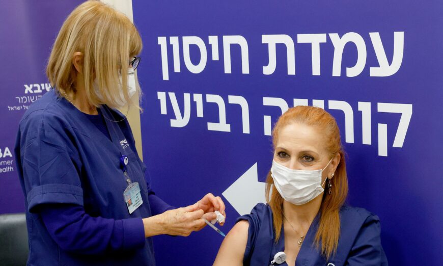 An Israeli nurse receives a fourth dose of the Pfizer-BioNTech COVID-19 vaccine at the Sheba Medical Center in Ramat Gan near Tel Aviv, on Dec. 27, 2021. (Jack Guez/AFP via Getty Images)