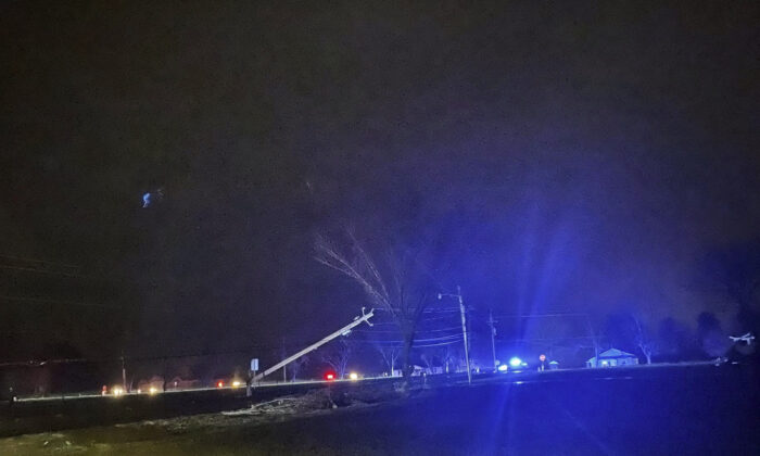 Authorities close down a road after power lines came down and homes suffered damage in Hazel Green, Ala., on Jan. 2, 2022. (Madison County Sheriff's Office via AP)