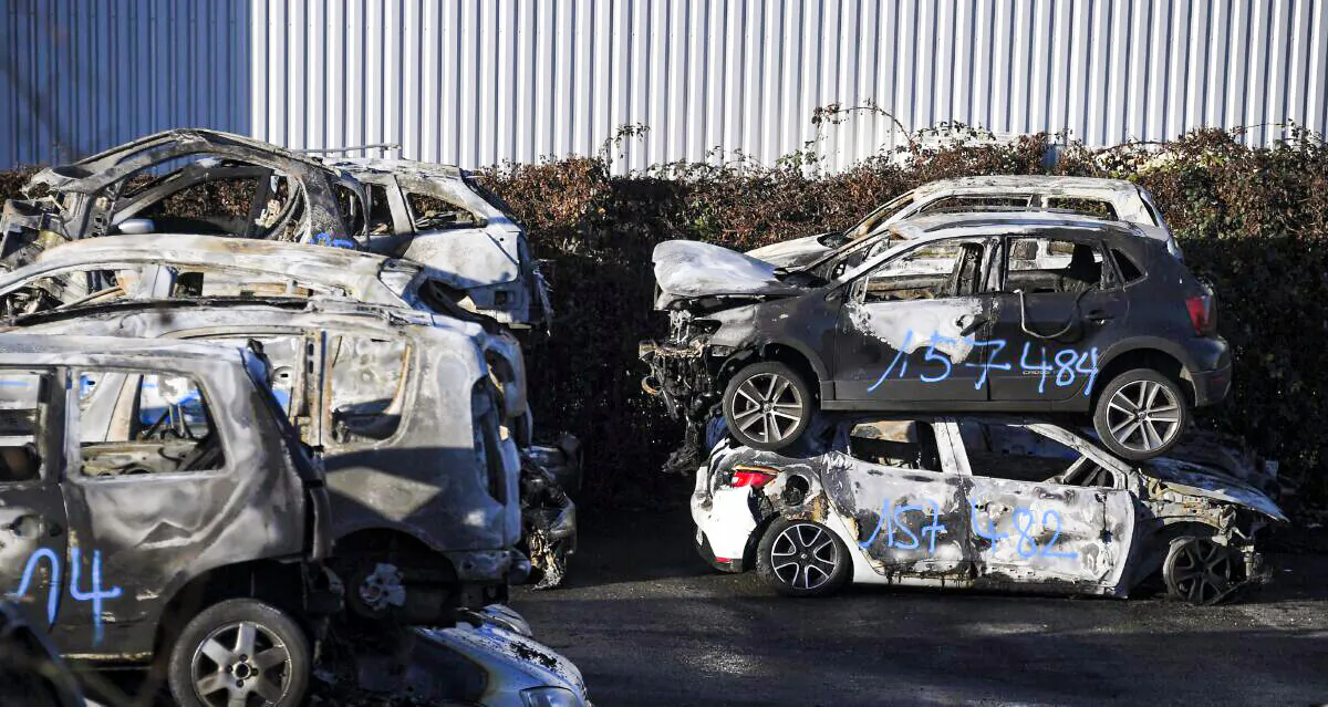 Burnt-out cars collected by city employees after the New Year's eve in the eastern French city of Strasbourg on Jan. 1, 2022. (Frederick Florin/AFP via Getty Images)