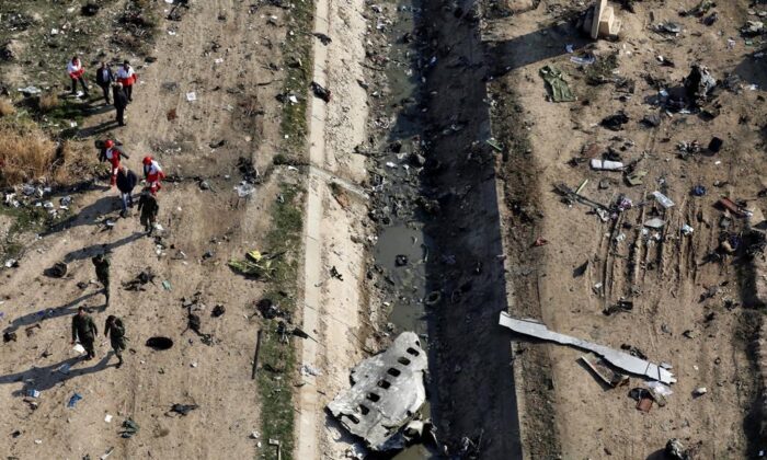 Rescue workers search the scene where a Ukrainian plane crashed in Shahedshahr, southwest of the capital Tehran, Iran, on January 8, 2020. (The Canadian Press, Ebrahim Noroozi)