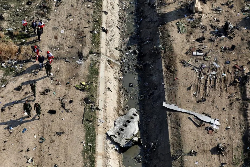 Rescue workers search the scene where a Ukrainian plane crashed in Shahedshahr, southwest of the capital Tehran, Iran, on January 8, 2020. (The Canadian Press, Ebrahim Noroozi)
