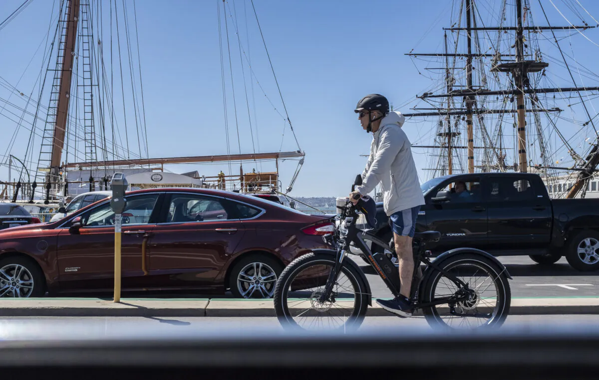 A man rides an E-Bike in San Diego, Calif., on March 27, 2021. (John Fredricks/The Epoch Times)