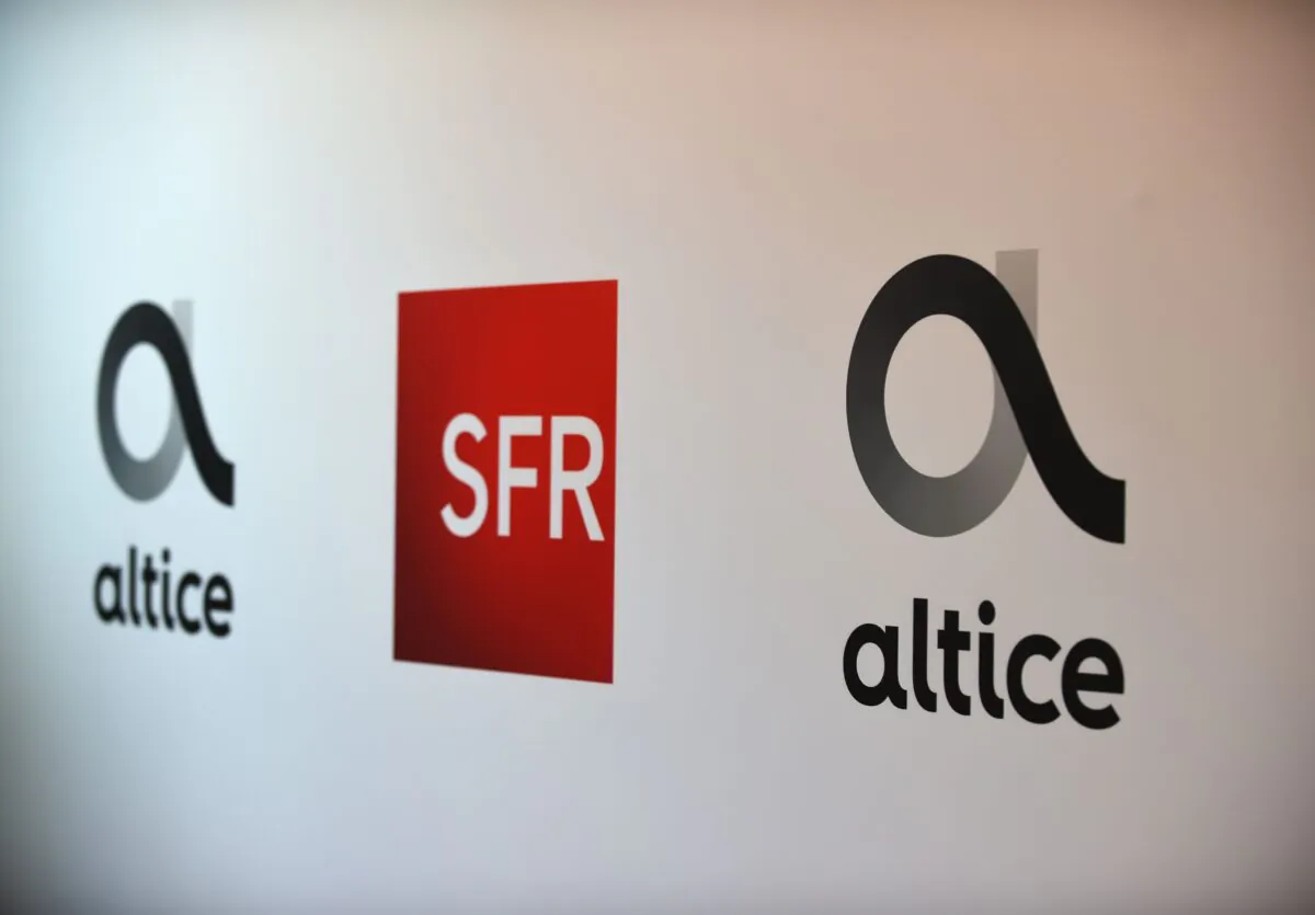 Logos of French telecom groups Altice and SFR is pictured, during a press conference to present Altice France 2019 prospects, in Paris, on April 11, 2019. (Eric Piermont/AFP via Getty Images)