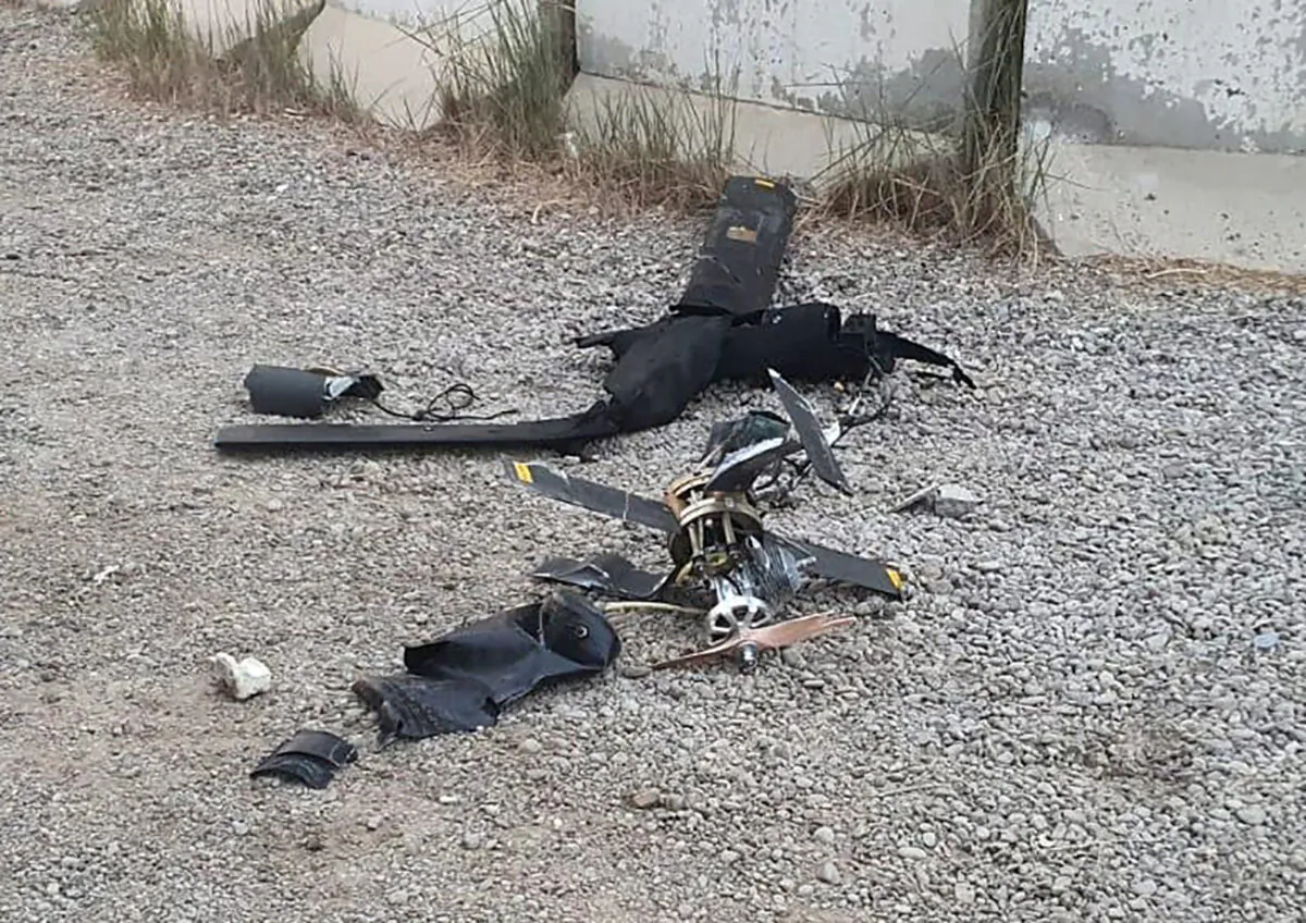 Parts of the wreckage of a drone lie on the ground at Baghdad airport, Iraq, on Jan. 3, 2022. (International Coalition via AP)
