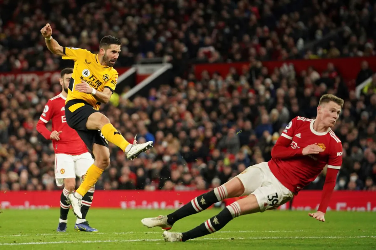 Wolverhampton Wanderers' Joao Moutinho scores his side's first goal during the English Premier League soccer match between Manchester United and Wolverhampton Wanderers at Old Trafford stadium in Manchester, England, on Jan.3, 2022. (Dave Thompson/AP Photo)
