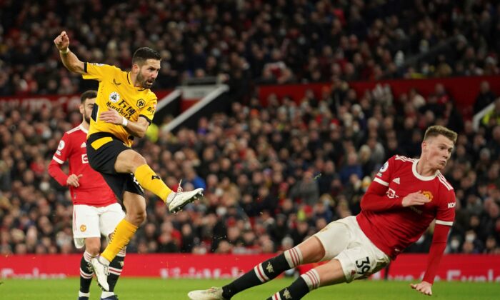 Wolverhampton Wanderers' Joao Moutinho scores his side's first goal during the English Premier League soccer match between Manchester United and Wolverhampton Wanderers at Old Trafford stadium in Manchester, England, on Jan.3, 2022. (Dave Thompson/AP Photo)
