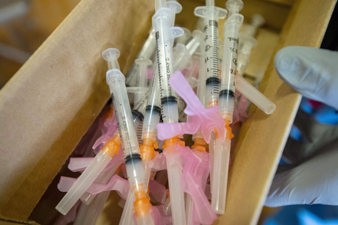 Syringes with a COVID-19 vaccine are pictured in Central Falls, R.I., in a file photograph. (Joseph Prezioso/AFP via Getty Images)
