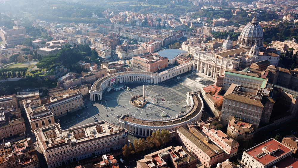 In 1626, when St. Peter's Basilica was completed, all roads led to Rome and, in Rome, all roads led to St. Peter's Basilica. In front of the basilica, St. Peter’s Square welcomes and embraces pilgrims and guests and offers them a gathering place. On significant occasions, the square holds some 300,000 people. (Aerial-motion/Shutterstock)